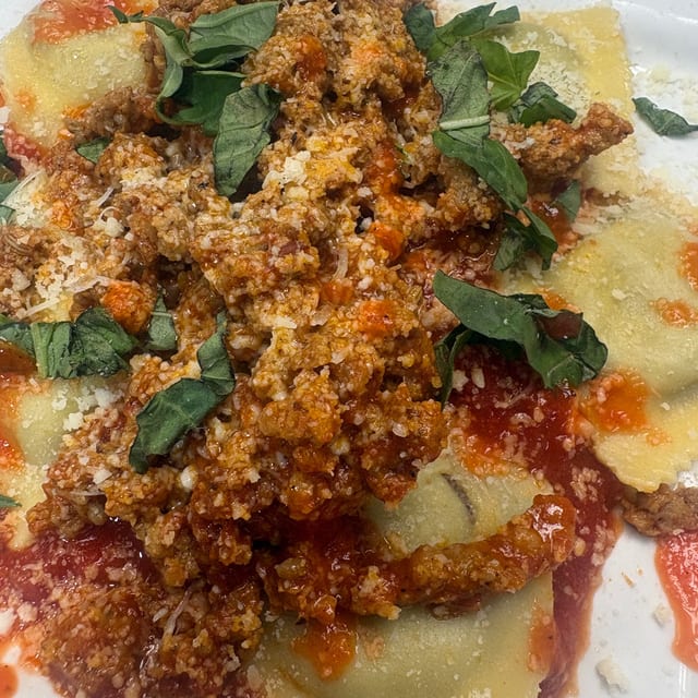 Beef Ravioli with sausage ragu.